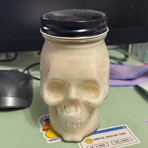Skull-Shaped Candle with Black Lid.